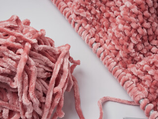 Wool yarn in different colors with wooden double point needles. The needles are being used for knitting socks, mittens or other projects joined in the round.