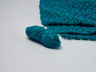 Wool yarn in different colors with wooden double point needles. The needles are being used for knitting socks, mittens or other projects joined in the round.