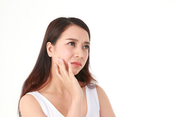Fototapeta premium A beautiful Asian woman with long hair is stressed and worried about her facial skin problems. Beauty concept. Beautiful skin care. Acne treatment. White background.