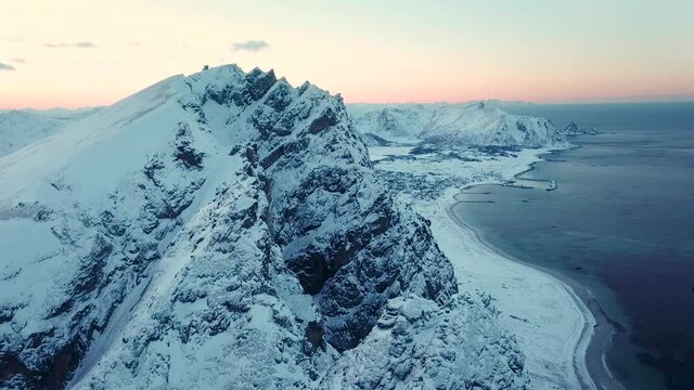Aerial drone view of norways mountains close to Andenes, Andoya - Winter landscape in snow and ice