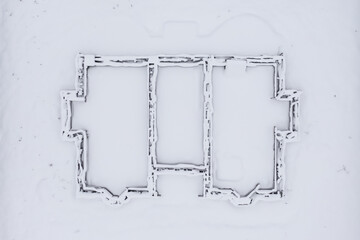 Top view of house foundation under snow. Real house plan. Construction site in winter