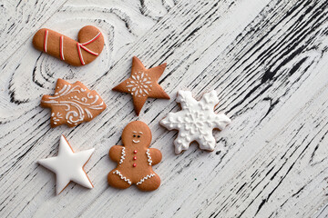 Collection of Christmas gingerbread cookies on a white wooden background