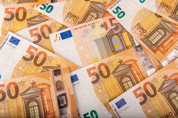Closeup of a group of fifty euros banknote background