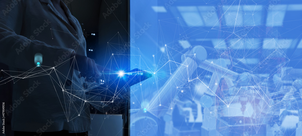 Leinwandbilder Factory Female Industrial Engineer working with automation robot arms machine in intelligent factory industrial on real time monitoring system software.Digital future manufacture.