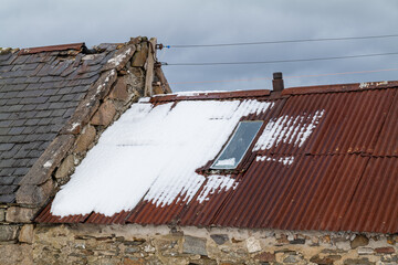 INVERDRUIE, AVIEMORE, SCOTLAND - 6 JANUARY 2022: - This is a scene of a long disused Farm and its house within the Caingorms Region of Aviemore, Scotland on 6 January 2022.
