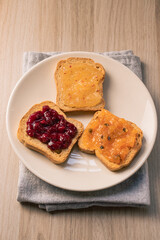 Breakfast toast with strawberry and passion fruit jam