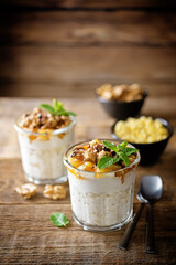 Greek yogurt millet caramelized apple walnuts parfait in a glass