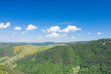 The forest and fields of the Ardeche countryside in Europe, France, Ardeche, in summer, on a sunny day.