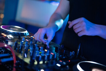 Dj mixing at party festival with light and smoke in background - Summer nightlife view of disco...