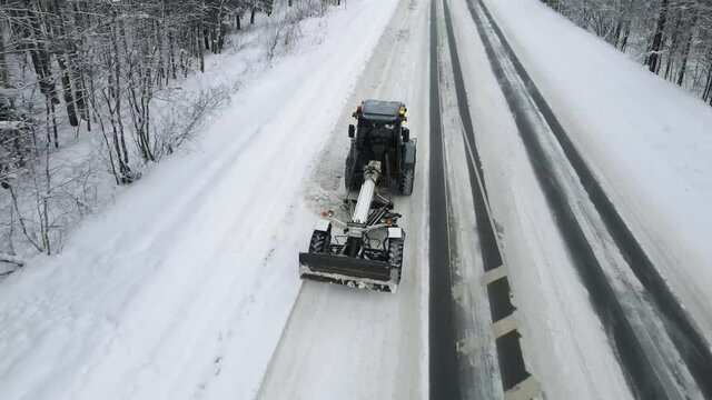 Snowblower cleans snow on the track. Aerial view