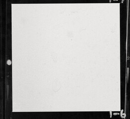 close up, real flat bed scan of black and white hand copy contact sheet with 1 empty film frame and...