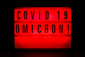 Sign with an inscription Covid 19 Omicron. Covid 19 Pandemic. Selective focus