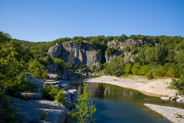 The Gorges de lArdeche in lush green vegetation in Europe, France, Ardeche, in summer, on a sunny day.