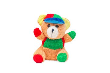 A teddy bear toy sits on a white background. Isolated children's toy on a white background.