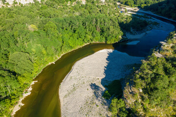 Fototapeta na wymiar The river and its meanders in the middle of the Gorges de lArdeche in Europe, France, Ardeche, in summer, on a sunny day.