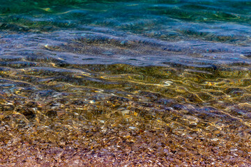 Perfect clear sea water and seabed near shore. Enticing view of clear sea water and seabed