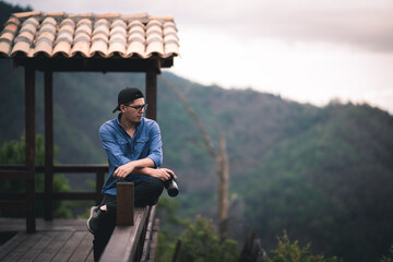 person on a mountain taking photos