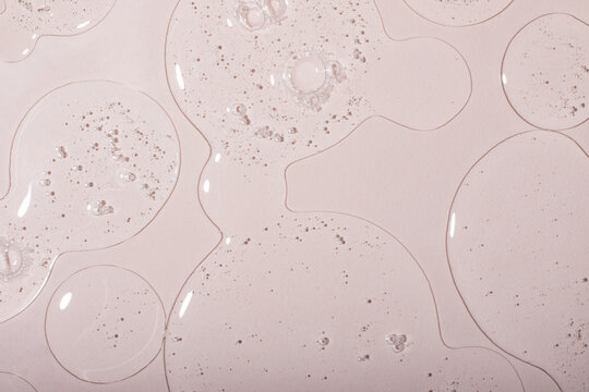 Top view of liquid cosmetics gel with bubbly structure on pastel background.Good as cosmetic mockup.