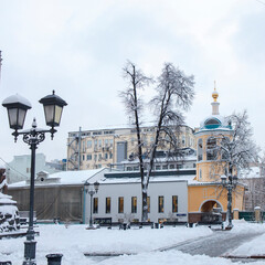 Moscow, Russia, the temple of the Holy Wonderworkers Cosmas and Damian in the Christmas holidays. In Stoleshnikov lane the Church kindly opened the gate for its parishioners.