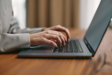 Female hands typing on computer keyboard study or work with laptop software tech. Online job or...