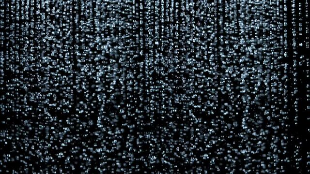 Super Slow Motion Shot of Many Water Drops Falling Down on Black Background at 1000fps.