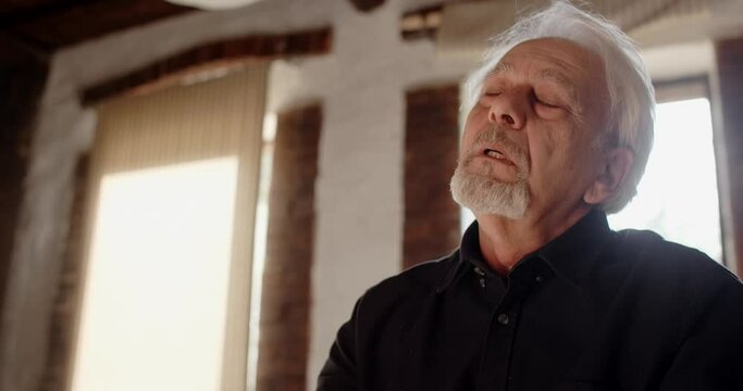 Depressed hopeless old gray haired man is in sorrow, 4k 60p Prores