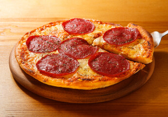 Pizza Salami lay on the table