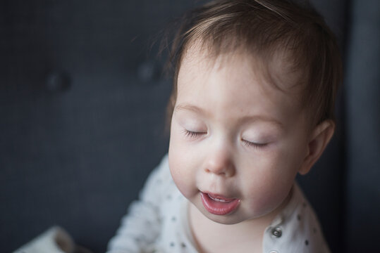 Portrait Of A 1 Year Old Baby With Two Teeth