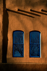 Deep Blue Windows and saturated adobe walls at Sunrise makes for a beautiful visual description of Santa Fe.