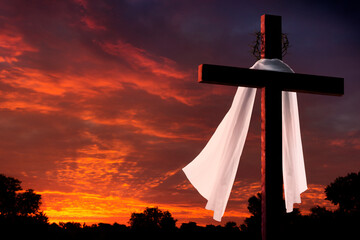 This dramatic sunrise lighting and Easter Cross makes a great Easter photo illustration of Jesus...