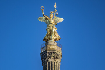 Fototapeta na wymiar Berlin Victory Column (Siegessaeule, 67 metres,1864) with Statue of Victoria (Goldelse) on top, to commemorate Prussian victory in Second Schleswig War. Berlin, Tiergarten, Germany.