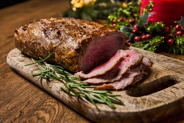 Sliced Baked roast meat, isolated on wooden background. High quality photo
