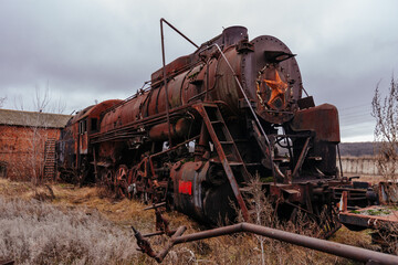 Old rusty abandoned steam locomotive 