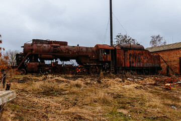 Fototapeta na wymiar Old rusty abandoned steam locomotive