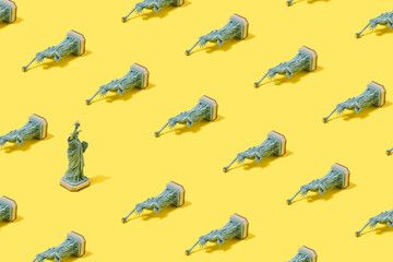 Statue of liberty figurine pattern on pastel pink background. USA strategy minimal concept.