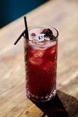 red berry cocktail with nightclub