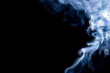 Fototapeta premium Abstract blue smoke on a dark background. Blue smoke background