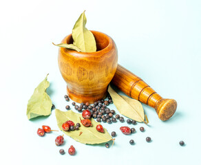 wood mortar and pestle, with daphnia Leaf, herbal, wild rose, hawthorn black
