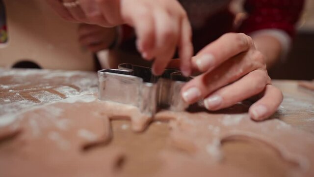 close up shot of female hands that are making dough for cookies. High quality 4k footage