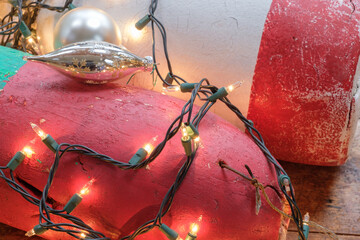 Colorful Maine Red green and white lobster float buoys surrounded by Christmas holiday lights