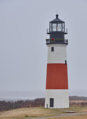 The Sankaty  Head Coast Guard Lighthouse on the island of Nantucket on a drizzly and foggy day © Jorge Moro