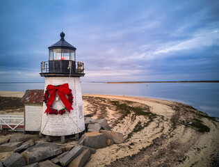 The beautiful and famous Brant Point Lighthouse at the entrance to Nantucket Island Harbor.