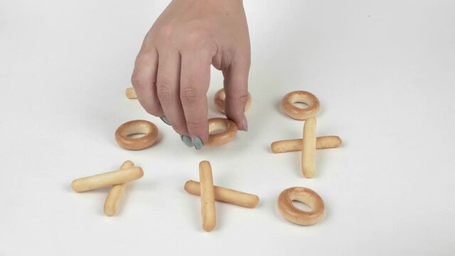 A handful of freshly baked breadsticks, isolated on a white background. Tic Tac Toe is a game of breadsticks isolated on a white background.