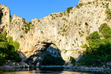 Fototapeta na wymiar The Pont dArc in the Ardeche gorges in the middle of nature in Europe, France, Ardeche, in summer, on a sunny day.