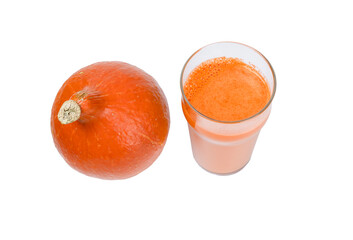 Pumpkin juice in a glass and a small pumpkin isolated on a white background.