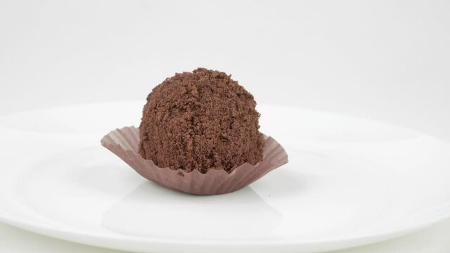 Homemade cake. Chocolate cakes in the shape of a ball for Breakfast on an isolated background. Slow rotation.