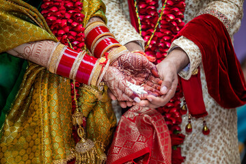 Fototapeta na wymiar Indian Hindu wedding ceremony ritual items, hands and feet close up
