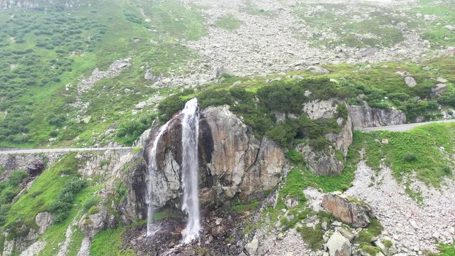Amazing footage of a wonderful waterfall in Switzerland. epic shot with a drone.
