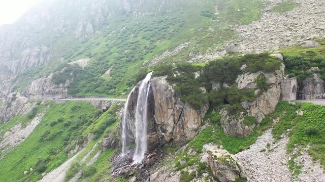 Amazing footage of a wonderful waterfall in Switzerland. epic shot with a drone.