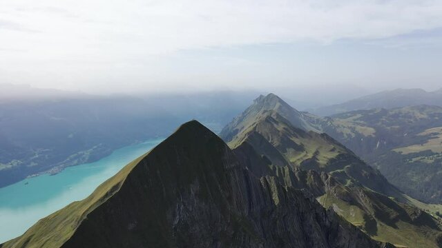 Amazing footage over the beautiful places in Switzerland. A wonderful areal flight at a sunny day in the alps. Epic drone flight over the beautiful mountains at the lake Brienz called Brienzergrat.